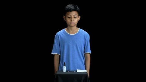 Young man using alcohol rub alternative to washing his phone Stock Footage 126883728