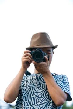 Young man using camera Stock Photos