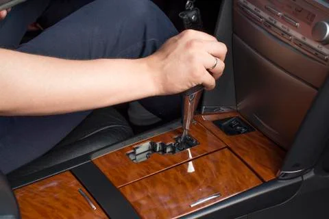Young man using car gearshift Stock Photos