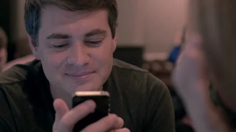 Young man using cell phone with happy look Stock Footage 52498682