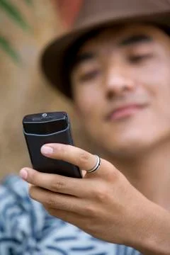 Young man using cell phone Stock Photos