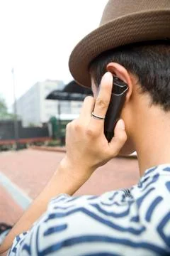 Young man using cell phone Stock Photos