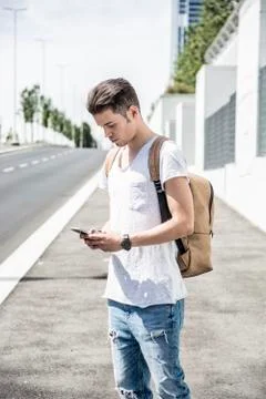 Young man using cell phone in city Stock Photos