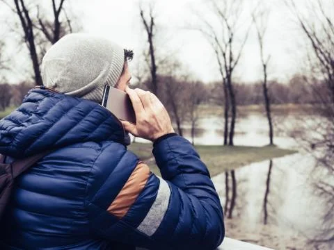 Young man using cell phone in park Stock Photos