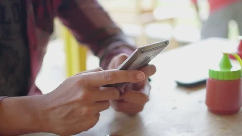 A young man using cellphone close up 스톡 동영상 83668949