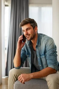 Young man using cellphone for work, social media or relaxation. Smart phone.. 스톡 사진