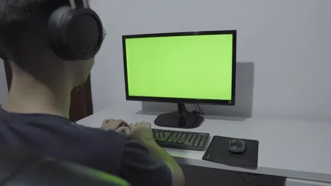 Young man using a computer - chroma key Stock Footage 144545602