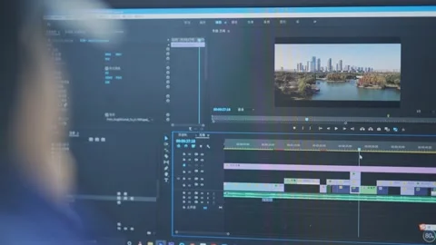Young man using computer to edit video Stock Footage 194520932