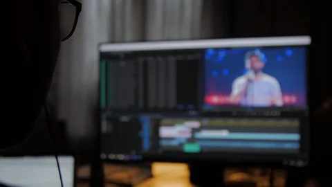 Young Man using Computer, Editing a video in editing software, Shot from Stock Footage 100369697