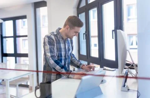 Young man using computer in office 写真素材