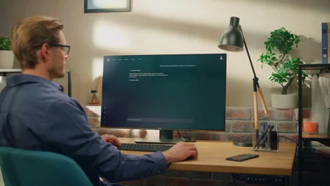 Young Man Using Desktop Computer with AI Software Stock Footage 296176328