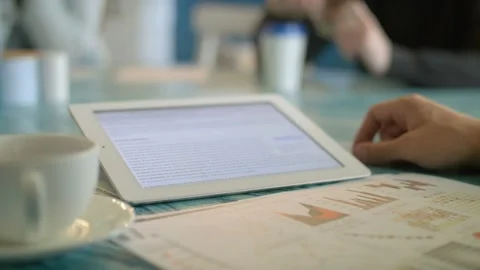 Young man Using Digital Tablet Ipad Computer In Cafe Video stock 97582531