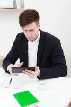 Young man using a digital tablet Stock Photos