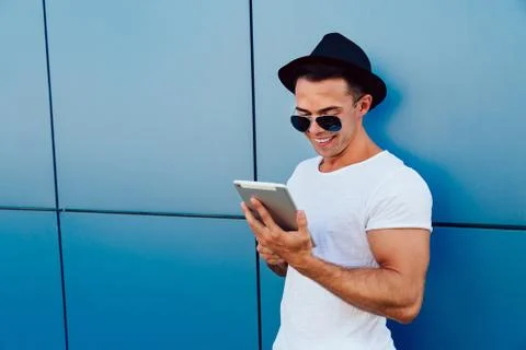 Young man using digital tablet outdoors. Stock Photos