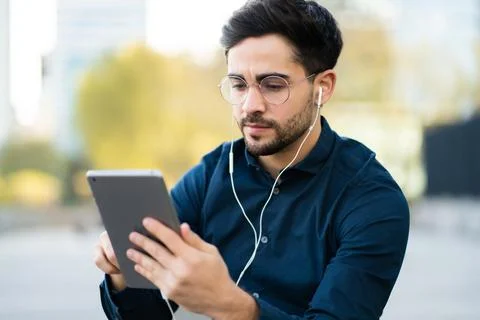 Young man using digital tablet outdoors. Foto stock