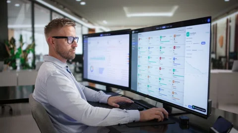 Young Man Using ERP Software On Desktop Stock Footage 346923854