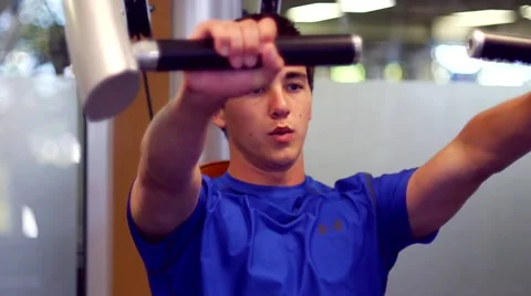 Young Man Using Exercise Equipment Stock Footage 5525200