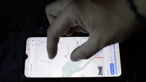 Young man using google gps maps app on his phone. phone gps technology Video stock 194653689