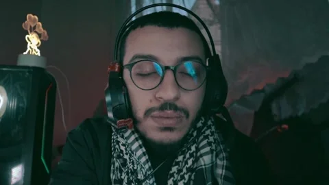 Young man using headphones to relax Stock Footage 299574727