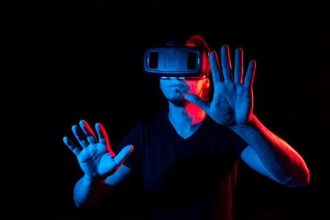A young man using high-tech virtual reality glasses Stock Photos