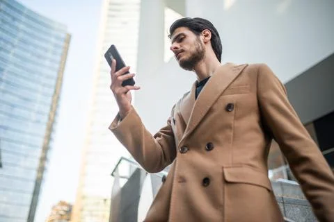 Young man using his cellphone outdoor Foto stock