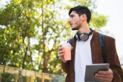 Young man using his digital tablet. Stock Photos