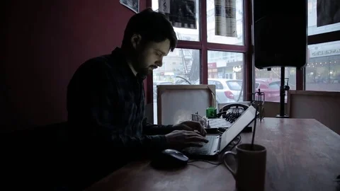 Young man using his laptop Stock Footage 73297182
