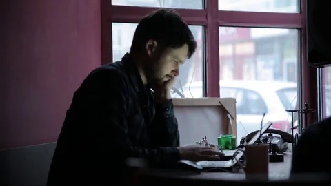 Young man using his laptop Stock Footage 73297184