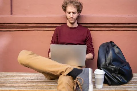 Young man using his laptop. Stock Photos