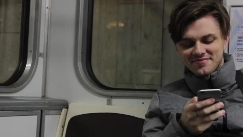 Young man is using his mobile phone Stock Footage 123713001