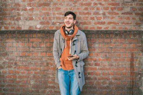 Young man using his mobile phone. Stock Photos