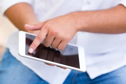 Young man using internet outdoor,selective focus Stock Photos