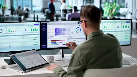 Young Man Using Laptop And Tablet Stock Footage 340996687