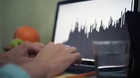 Young man using laptop in cafe. Glass of water, notepad and pencil on table Stock Footage 82935898