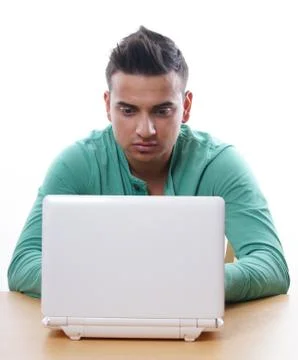 Young man using laptop computer Stock Photos
