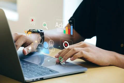 Young man using laptop with data exchanges development. Stock Photos