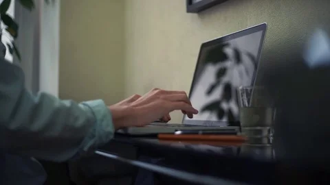 Young man using laptop at home. Browser page on laptop screen. Video stock 82925330