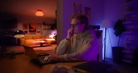 Young Man Using Laptop at Home Cinema Robot Footage Stock Footage 320883903