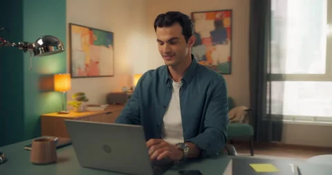Young Man Using Laptop at Home Cinema Robot Footage Stock Footage 320883908