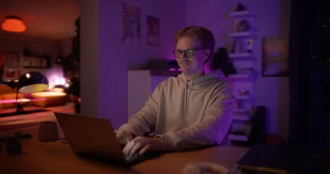 Young Man Using Laptop at Home Cinema Robot Footage Stock Footage 320883912