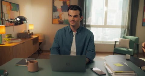 Young Man Using Laptop at Home Cinema Robot Footage Stock Footage 320883967