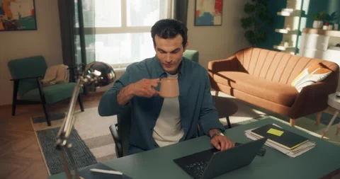 Young Man Using Laptop at Home Cinema Robot Footage Stock Footage 320883996