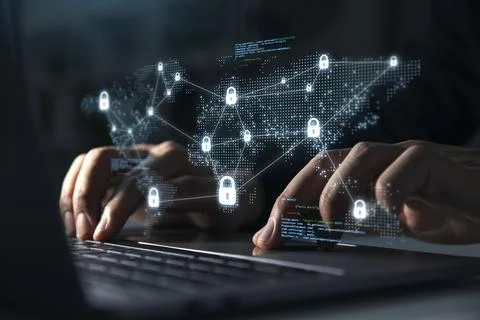Young man using laptop with lock icon for business and internet. Stock Photos