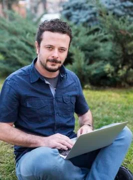 Young Man Using Laptop Stock Photos