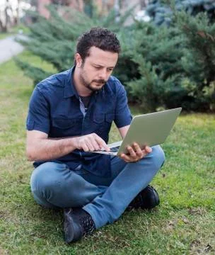 Young Man Using Laptop Stock Photos