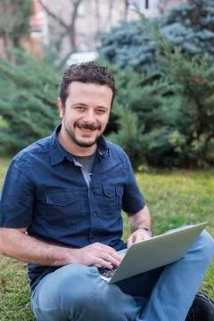 Young Man Using Laptop Stock Photos