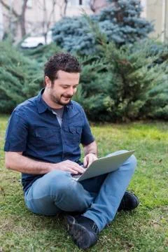 Young Man Using Laptop Stock Photos