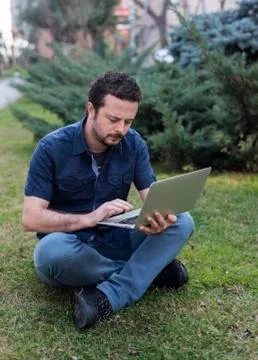 Young Man Using Laptop Stock Photos