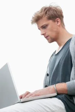 Young man using a laptop Stock Photos