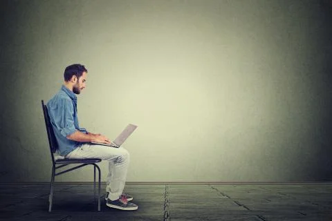 Young man using a laptop Stock Photos